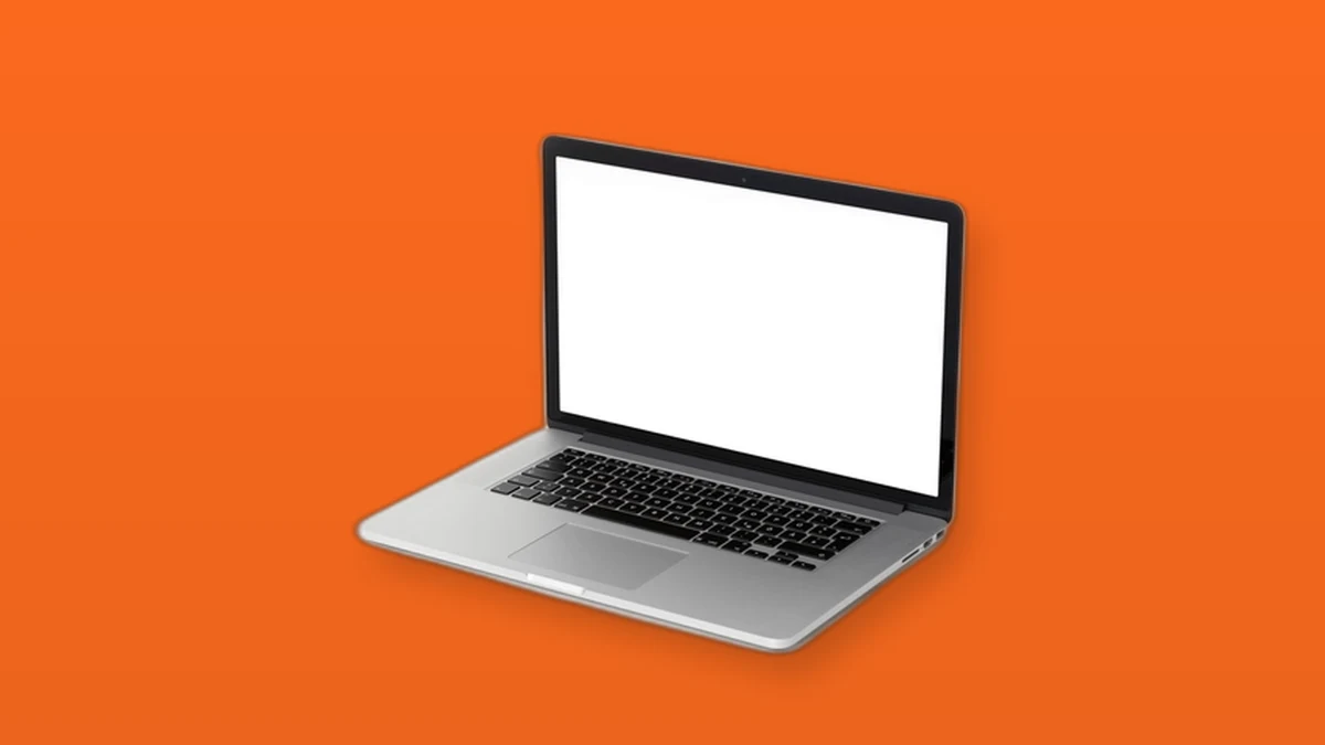 Photo illustration of an open silver laptop with a blank screen on an orange background