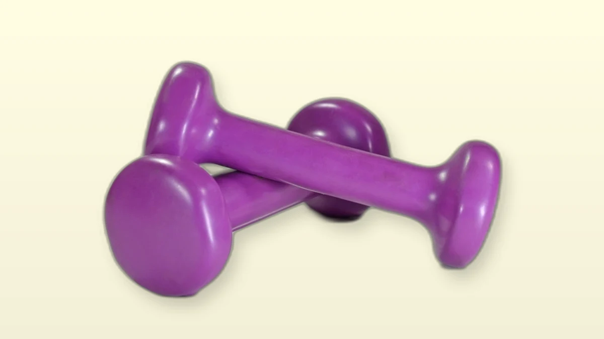 Two purple dumbbells resting on a cream-colored background