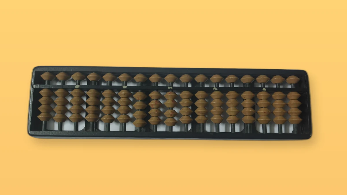 Photo illustration of a wooden abacus on a peach background, symbolizing mathematical modeling.