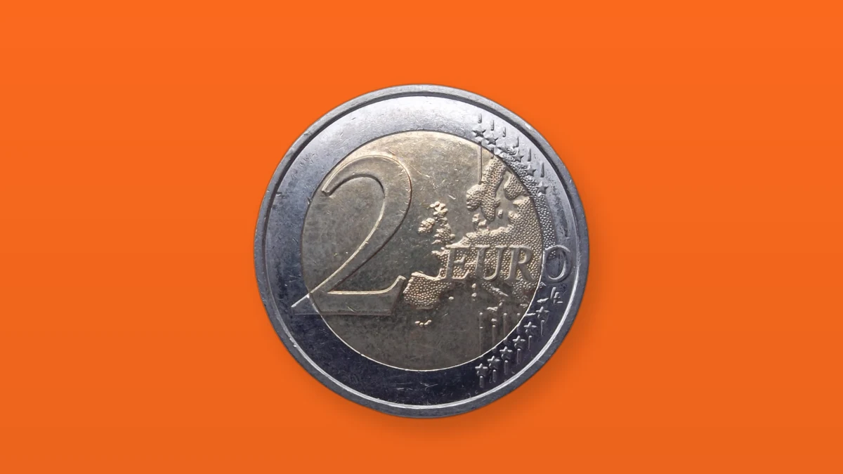 Photo illustration of a two euro coin on an orange background, symbolizing the multibillion euro merger.