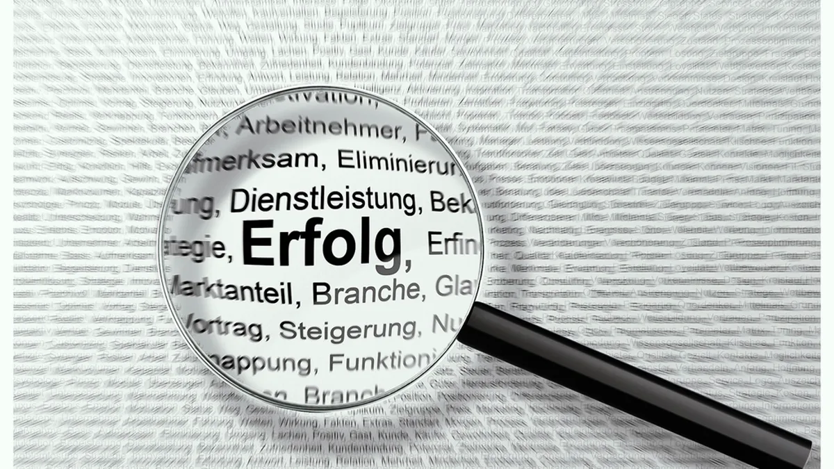 Magnifying glass enlarging text on a printed page