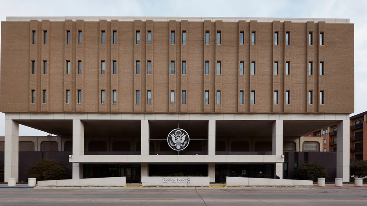 A United States federal building with the Great Seal above its entrance