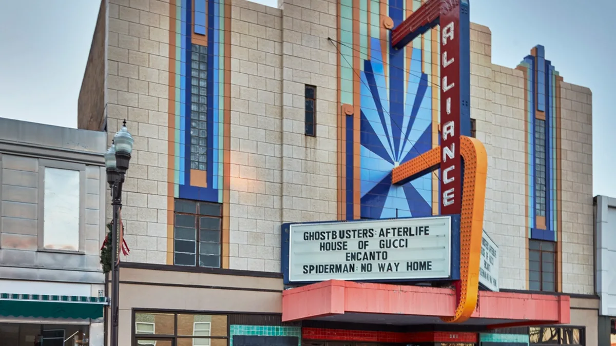 An art deco cinema marquee listing current film titles