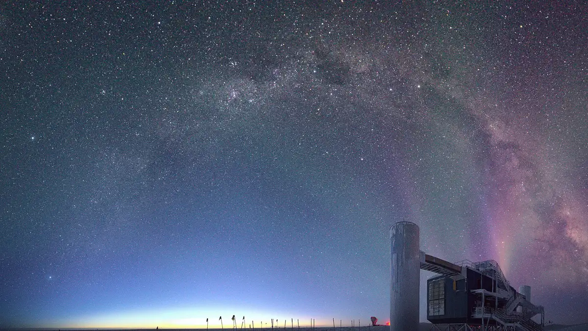 The IceCube Laboratory at the South Pole under the Milky Way at dawn