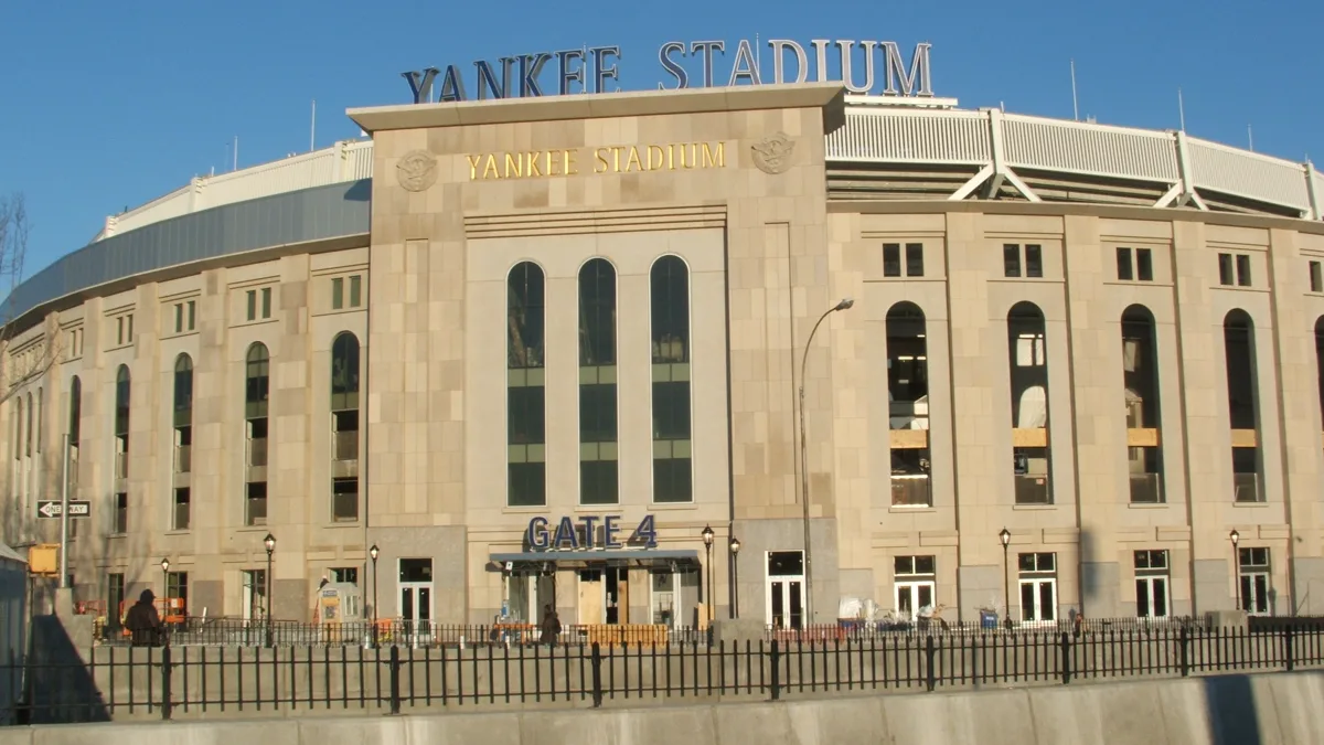 The exterior facade and Gate 4 entrance of Yankee Stadium in the Bronx