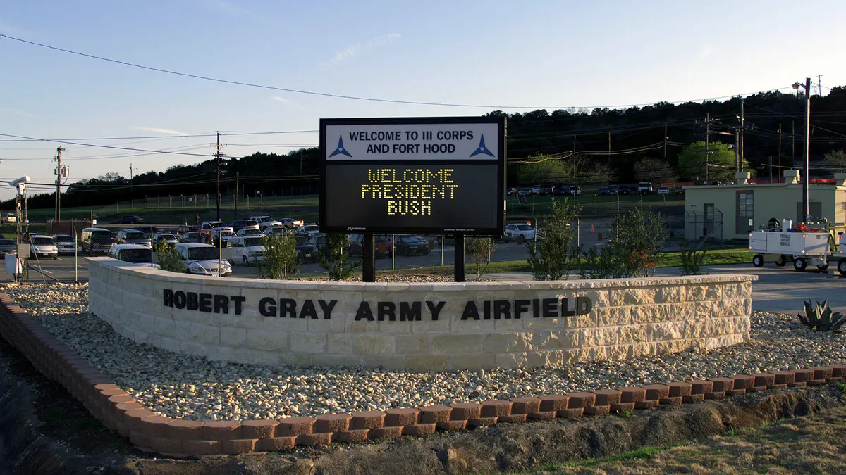 A welcome sign for III Corps and Fort Hood at Robert Gray Army Airfield in Texas