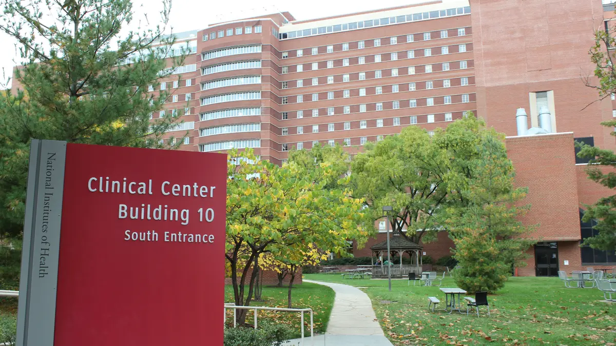 Sign reading Clinical Center Building 10 South Entrance outside the NIH campus in Bethesda