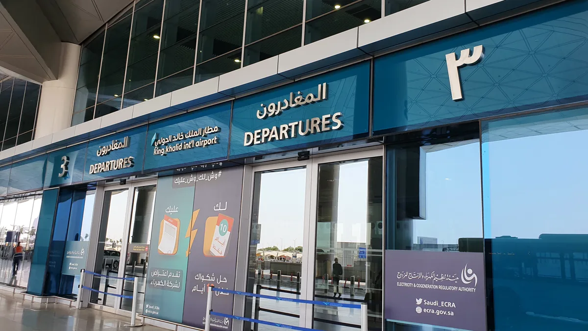 Departures hall signage at King Khalid International Airport in Riyadh