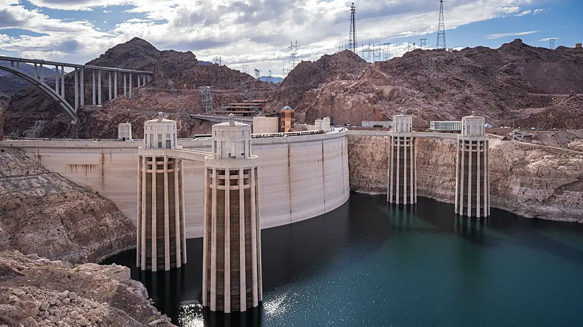Hoover Dam intake towers above Lake Mead, with a pale ring marking former water levels