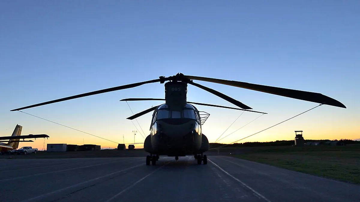 A Chinook helicopter silhouetted at dusk during the Canadian Army's Maple Resolve training exercise