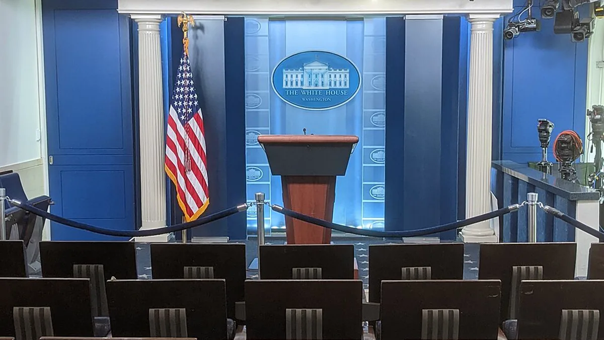 The empty podium and press seats in the White House briefing room