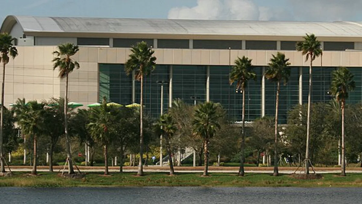 Exterior of the Florida Panthers arena in Sunrise, Florida, seen across a lake