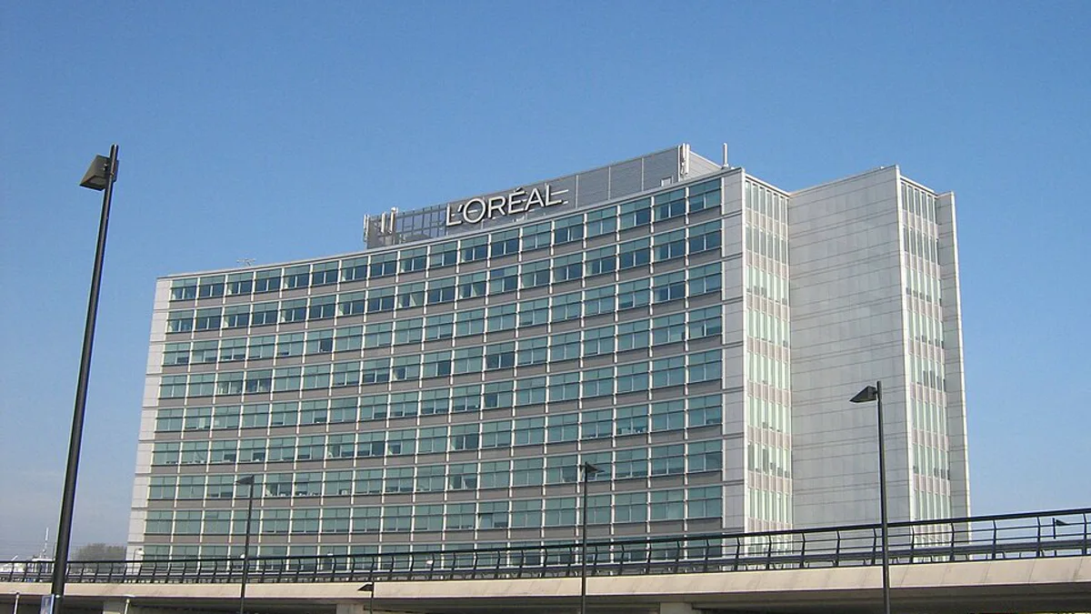 A L'Oreal office building with the company name in large letters across the roofline